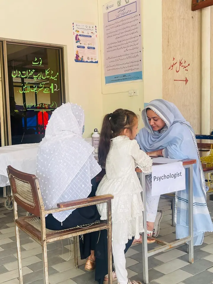 A Free Birds occupational therapist working with a mother and child