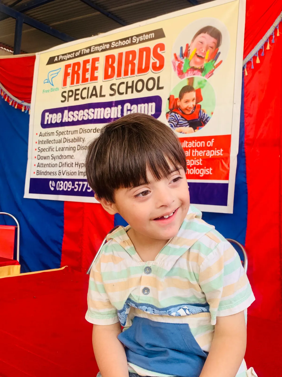 A boy smiling at a Free Birds assessment camp